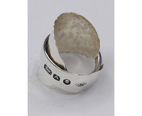 A solid silver spoon ring made from Antique cutlery by an Artisan. Successful bidders can notify of the size that they want a