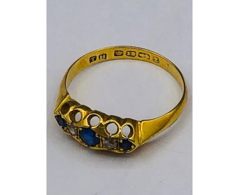 An 18ct gold ring with sapphires and diamonds