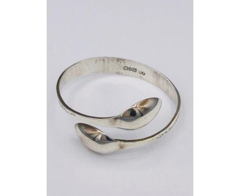 A Hallmarked silver bangle, Artisan made from silver spoons