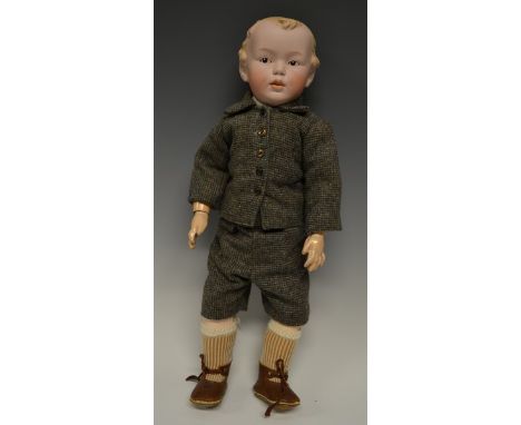 A Heubach bisque porcelain head boy doll, moulded and painted hair, fixed blue eyes, closed mouth, composite body and jointed