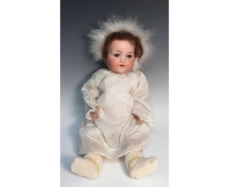 An Armand & Marseille bisque head doll, sleeping blue glass eyes, open red lips revealing four large top teeth,   painted fea