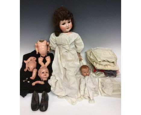 A Kammer & Reinhardt/ Simon & Halbig bisque head baby doll, open close blue glass eyes, open mouth, brown wig, composite body