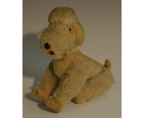A Steiff Snobby Poodle, white blond fur, glass eyes, adjustable limbs, red tongue, brown moulded nose, missing ear button, 20