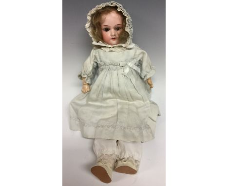 An Armand & Marseille bisque head doll, sleeping brown glass eyes, open red lips revealing four large top teeth,   painted fe