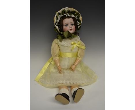 An Armand & Marseille bisque head doll, sleeping blue glass eyes, open red lips revealing four large top teeth,   painted fea