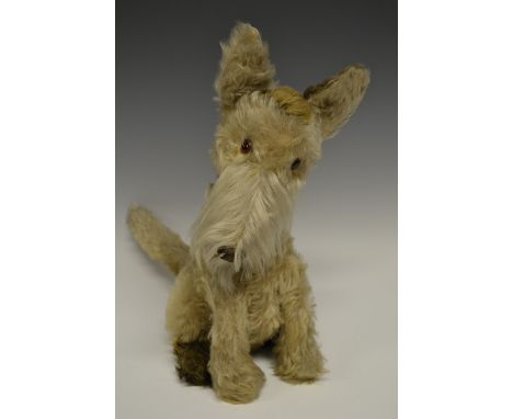 A Chad Valley Hygienic Toys Seated Terrier, straw stuffed grey body, plastic eyes, brown collar with button, erect ears and t