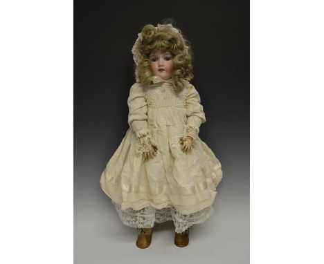 A large Armand & Marseille bisque head doll, sleeping blue glass eyes, open red lips revealing four large top teeth,   painte