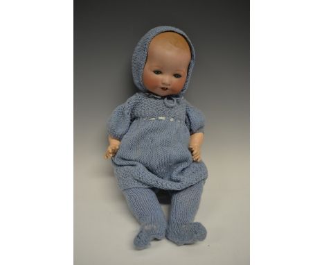 An Armand & Marseille bisque head and composition bent limb doll, sleeping blue glass eyes, open red lips revealing two large