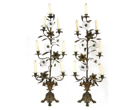 A pair of opaline glass and gilt metal seven-light candelabra,20th century, each in the form of a lily, on a triform base,88c