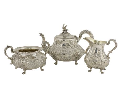 A Victorian three-piece silver tea set,by William Hunter, London 1848, comprising a teapot, milk jug and sugar bowl, each of 