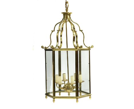 An hexagonal brass hanging lantern,late 20th century, with six electric socket sconces,49cm across93cm highCondition report: 