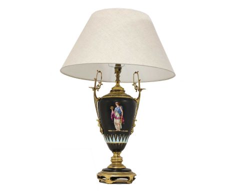 A French pottery and gilt metal table lamp and shade,early 20th century, the urn-shaped body decorated to each side with a cl