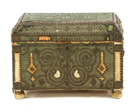 A small studded and cloth-bound chest,19th century, with a hinged caddy top and raised on bun feet,55cm wide21cm deep42cm hig