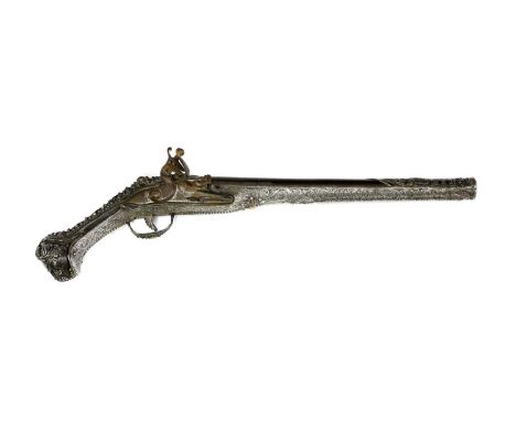 A Turkish silver-mounted flintlock pistol,early 19th century, the barrel with traces of scroll inlay and armourer's stamp, th