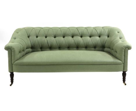 A George Smith chesterfield design settee,made by Ian McDonald, the deep buttoned back and arms above a stuff over seat uphol