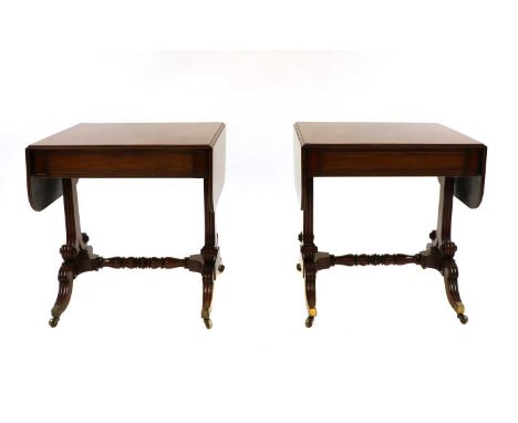 A pair of Regency mahogany sofa tables, each rectangular top with a moulded edge, above a single frieze drawer, raised on ree