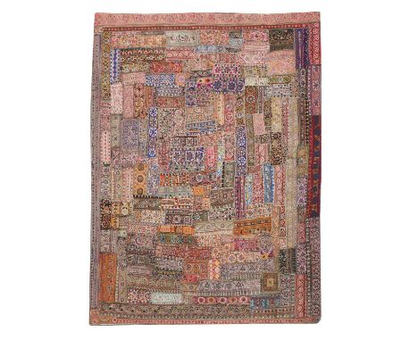 An Indian shisha embroidered patchwork cloth, 20th century, woven with numerous foliate and geometric motifs and set with mir