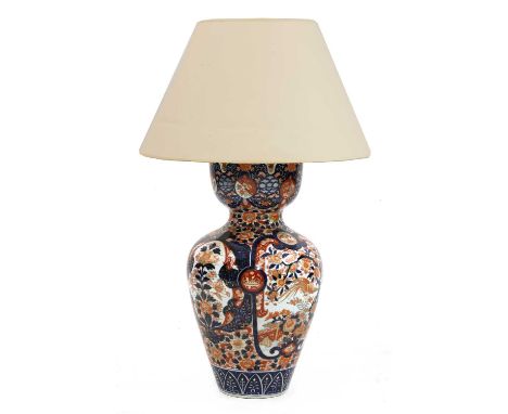 A large Imari table lamp and shade,the monteith-shaped neck on an ovoid body with traditional decoration,72cm high to the bay