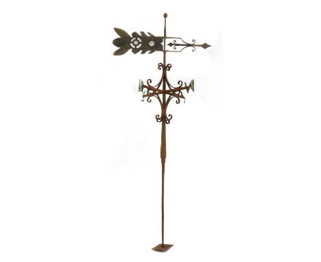A cast-iron weathervane,19th century, with scrolling wrought detail and an arrow-shaped wind indicator,97cm wide228cm highCon