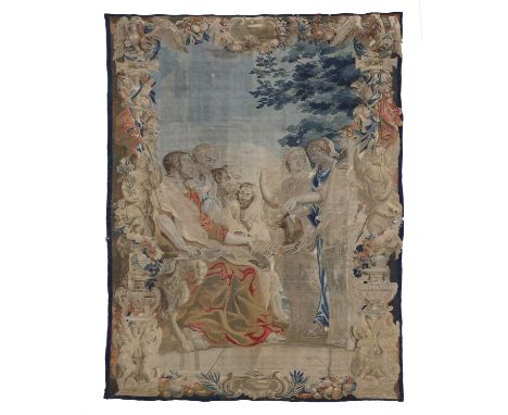 A large Brussels tapestry,17th century, depicting the reading of the testament of Augustus, within an ornate border of fruit 