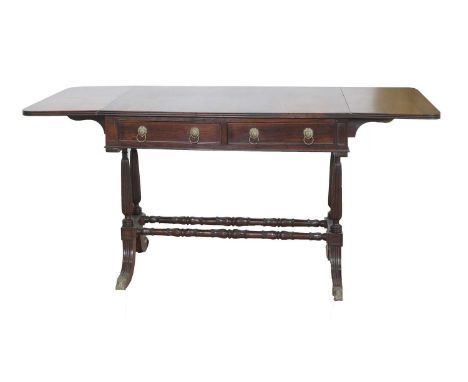 A Bengal rosewood 'Sheesham wood' sofa table, 19th century, with lion mask and ring handles, on lappit moulded supports unite