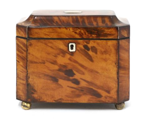 A tortoiseshell tea caddy,mid-19th century, of octagonal form, the caddy top opening to reveal two divisions within, raised o