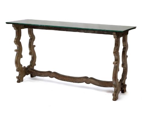 A bleached oak console table,20th century, French, the mirrored glass top above a carved 'os de mouton' comprising a pair of 