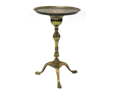 A George II brass kettle stand,with a later applied tray top over an ogee-shaped pierced pan, a baluster turned column and tr