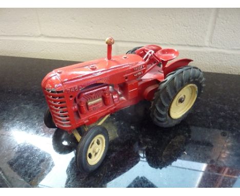AN UNBOXED LESNEY MASSEY-HARRIS 745D TRACTOR, playworn condition, missing exhaust stack, red body, cream hubs, black rubber t