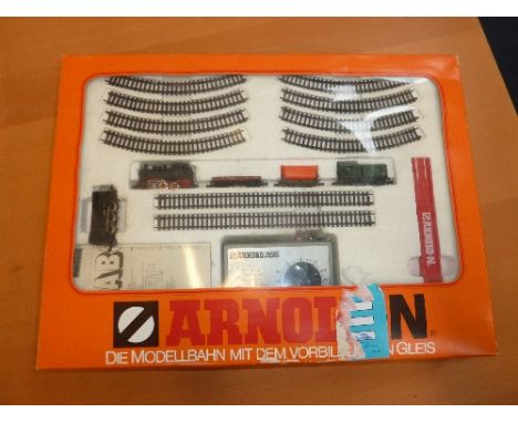 A BOXED ARNOLD N GAUGE TRAIN SET, No.0111A, comprising 0-6-0 DB tank locomotive, rolling stock, track, controller and instruc