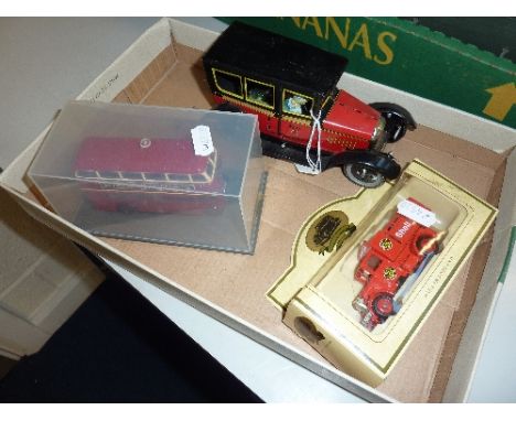 AN UNBOXED PAYA CLOCKWORK TINPLATE TAXI, missing key and has slight damage, believed to be an original model and not a 1980's