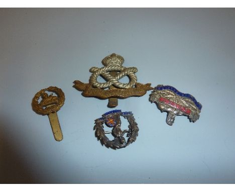 A SMALL BOX CONTAINING A SOUTH STAFFORDSHIRE REGIMENT WWI ERA CAP BADGE, two small enamel pin badges, Gloucestershire and Nor