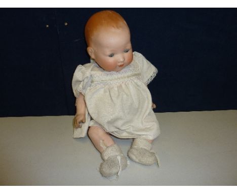 AN ARMAND MARSEILLE BISQUE HEAD BABY DOLL, nape of neck marked 'A.M. Germany 351. 18.K', sleeping eyes, open mouth with no te