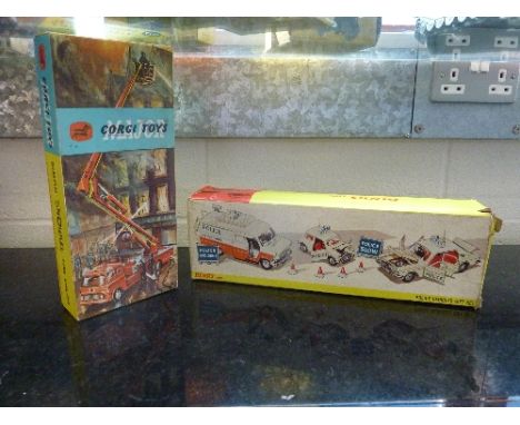 A BOXED DINKY TOYS POLICE VEHICLES GIFT SET, No.297, Ford Transit Van appears complete with all signs and cones, Mini is miss