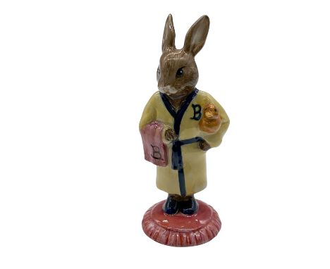 Bathtime, DB148. Rare hand decorated figure of a bunny in a yellow bathrobe with navy-blue trims and slippers. The bunny is s