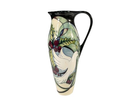 A stunning Moorcroft pitcher designed by Nicola Slaney, featuring a hand painted design of a dove in flight amidst vibrant ho