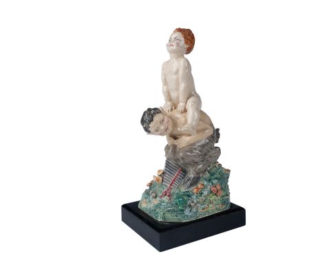 A whimsical ceramic figurine by esteemed British sculptor Charles Vyse, titled Leap Frog. This playful composition captures t