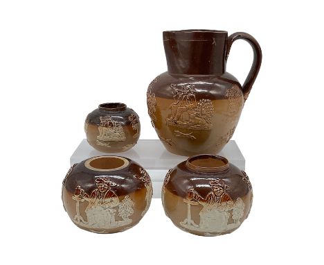 A set of four Doulton Lambeth stoneware pottery pieces, including a pitcher and three round candle holders, all marked "Doult