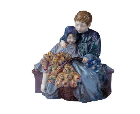 Exquisite Royal Doulton figurine in a rare colorway variation. Designed by Leslie Harradine, this charming piece depicts a yo