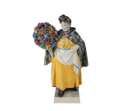 This exquisite ceramic figurine by Charles Vyse portrays the Windmill Woman, a charming depiction of English countryside life