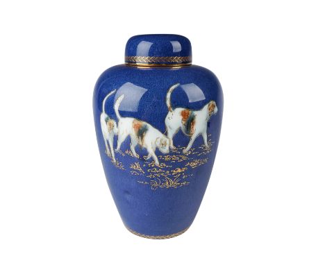 This elegant Wedgwood urn-shaped vase features a vibrant cobalt blue ground adorned with an intricate design of hunting dogs 
