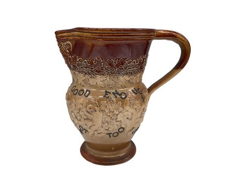 A Doulton Lambeth stoneware pitcher featuring elaborate relief decoration. This fine piece is adorned with high-relief scenes
