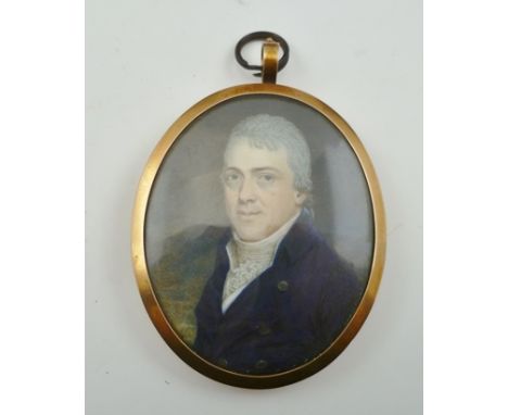 A GEORGE III PERIOD MINIATURE PORTRAIT PAINTING, bust length of a gentleman wearing a blue coat and white cravat, monogrammed