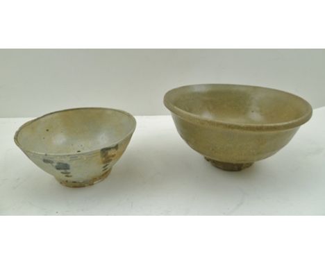 A CHINESE CELADON BOWL, possibly Ming, raised on low ring foot, 16cm diameter, together with a CHINESE BOWL dash decorated, 1