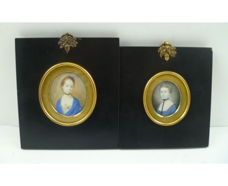 AN EARLY 19TH CENTURY MINIATURE PORTRAIT OF A LADY, bust length, wearing a blue gown, a black ribbon necklace, in ebonised fr