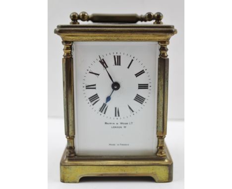 A MAPPIN AND WEBB BRASS CASED CARRIAGE CLOCK, French 8-day movement, bevel glass panelled in the round, white enamel dial wit