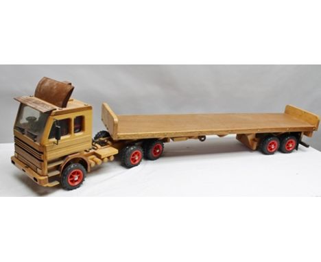 A SCRATCH BUILT STAINED WOOD EIGHTEEN WHEEL ARTICULATED LORRY, cab over tractor unit and flatbed trailer, together 152cm long