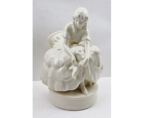 A GOLDSCHEIDER CERAMIC FIGURINE OF A SEATED LADY in crinoline dress, in cream glaze, 29cm high, with printed and impressed ma