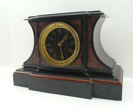 A VICTORIAN BLACK SLATE MANTEL CLOCK, inset rouge marble panels, circular black dial with carved and gilded Roman numerals, f