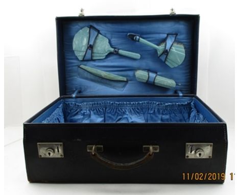 A LEATHER VANITY CASE, contains 'Xylonite' requisites, two brushes, comb and a hand mirror, c.1935, 50cm wide 
